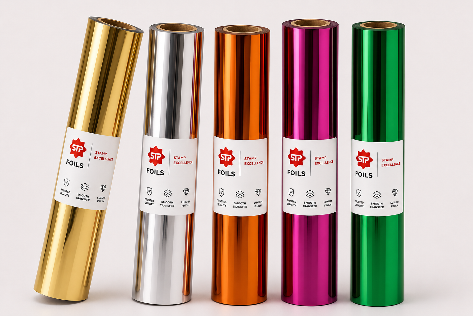 STP Foils digital foil rolls arranged on a light neutral background with labels visible.